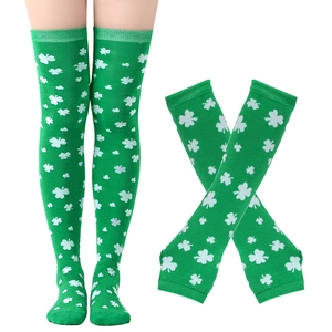 Detail of green knee-high socks featuring white shamrock patterns for St. Patrick's Day