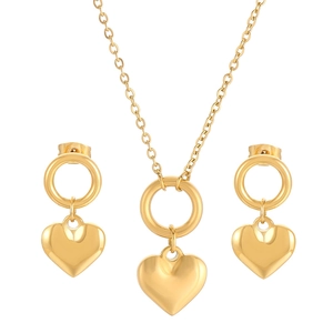 Polished gold stainless steel jewelry set featuring heart pendants with matching earrings
