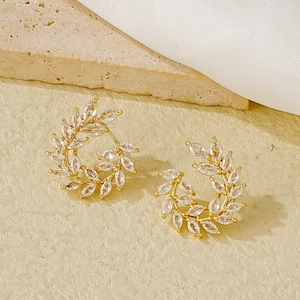 Elegant wheat leaf stud earrings in gold finish with sparkling marquise cut zirconia