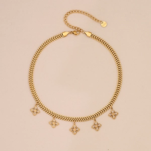 Detail of clover pendants and S.STEEL hallmark on golden stainless steel snake chain