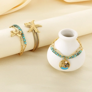 Double-layered gold starfish and palm tree bracelet with blue turquoise beads
