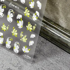 Detailed macro view of 5D embossed nail stickers featuring yellow and white flowers