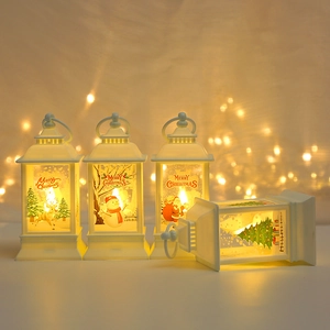 Set of four white LED Christmas lanterns with Santa and reindeer motifs for festive decor