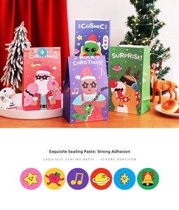 Detail of Christmas paper gift bags with cartoon designs and matching round stickers