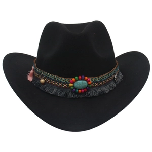 Detail view of ethnic beaded hatband with turquoise stones and pink tassels on wool cowboy hat