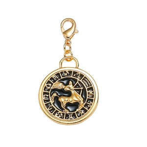 Gold Sagittarius tarot pendant with black enamel inlay and lobster clasp on white background
