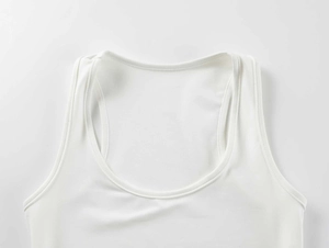 Detail of white square neck athletic tank top featuring fine ribbed knit texture