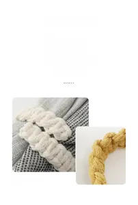 Close-up of hand-woven cotton curtain tiebacks in beige and yellow textured rope