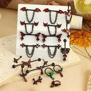 Gothic bat piercing set with black stainless steel, red zircons and heart chain detail