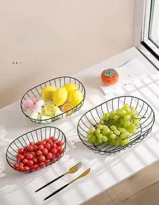 Three-piece black iron fruit basket set with minimalist oval wire mesh and sturdy base