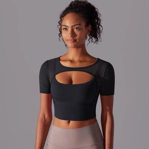 Detail of black mesh patchwork sports top with cutout design and high elasticity fabric