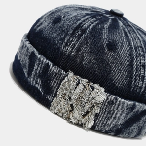 Retro washed denim docker hat in navy blue with distressed patches and rolled edge detail