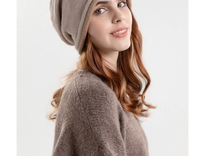 Detailed close-up showing soft coffee-colored knitted beanie texture and sweater fabric