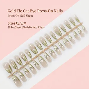 Golden cat eye press-on nails in trapezoid shape with elegant V-shaped tie design detail