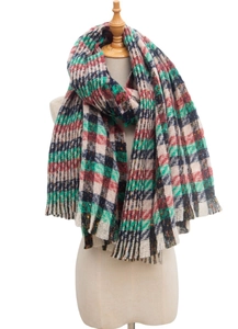 Classic red and green plaid thick knit scarf with soft fringe texture on a mannequin