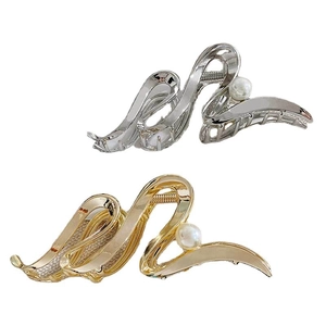 Elegant gold and silver metal hair claws with pearl accents in a sleek wavy design