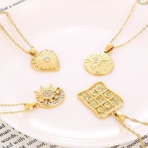 Set of 4 gold stainless steel necklaces with heart, sun and celestial zircon pendants