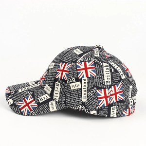 Close-up of UK flag and newspaper print on a vintage style graffiti baseball cap