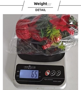Detailed scale view of small Christmas tree decoration weighing approximately 65 grams