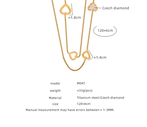 Detail of titanium steel multi-layer gold necklace with crystal heart pendants