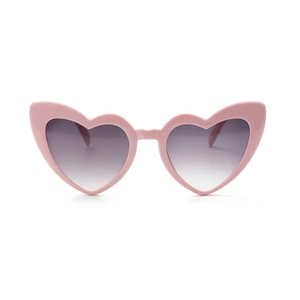 Close-up of pink heart-shaped sunglasses with purple gradient lenses on white background