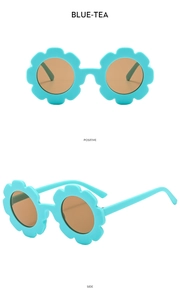 Front and side views of light blue flower-shaped sunglasses with brown round lenses