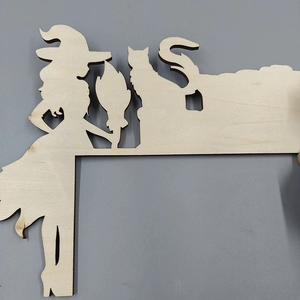 Laser-cut wooden Halloween door corner decor featuring witch and black cat silhouettes