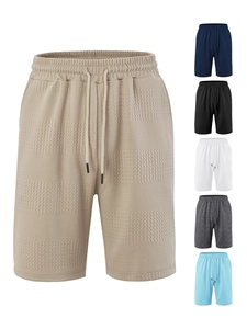Detail of waffle textured knit shorts for men showing elastic waist and six colors