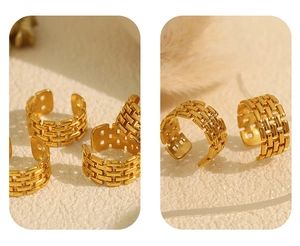 Macro detail of golden chain texture rings with irregular geometric open design