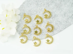 Detailed view of 18K gold plated moon and star celestial pendants for DIY jewelry crafts
