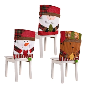 Detail of Christmas chair covers featuring Santa, Snowman, and Reindeer with plaid fringe