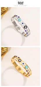 Detailed macro view of triple-layered hollow Evil Eye bangle with blue enamel and spring clasp