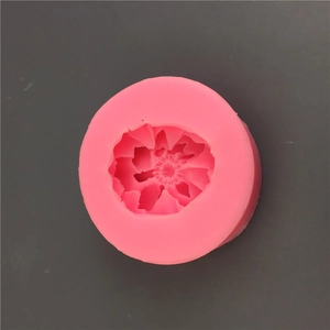 Detailed view of pink silicone mold featuring intricate peony flower shape for cake decorating