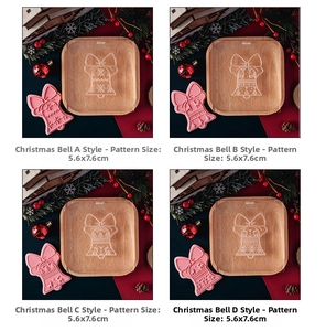 Set of four Christmas bell fondant molds with bow patterns for festive cake decorating