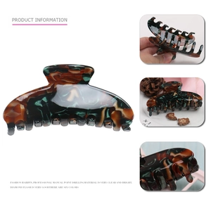 Elegant tortoise shell acetate hair claw clip for thick hair in dark green and red brown