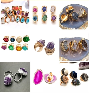 Detailed grid of natural geode and raw crystal adjustable rings in vibrant colors