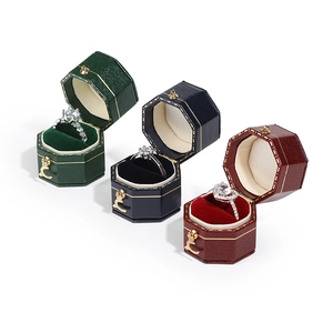 Octagon vintage jewelry boxes in green, navy, and red with velvet lining for rings