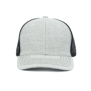 Close-up of grey fabric stitching and breathable black mesh on the trucker hat side