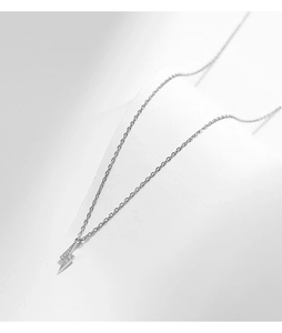 Close-up of S925 silver lightning bolt pendant with clear crystals on a dainty chain