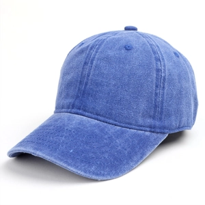 Close-up of blue washed denim baseball cap showing vintage texture and stitching detail