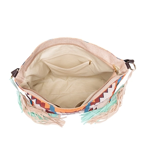 Detail view of woven tote interior with multiple pockets and colorful geometric fringe