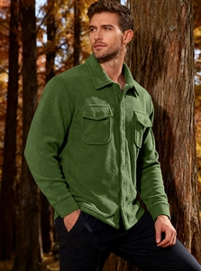 Outdoor shot of men's dark green fleece-lined tactical cargo shirt jacket with chest pockets