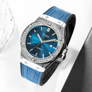 Detail of luxury women's quartz watch with blue leather strap and crystal bezel