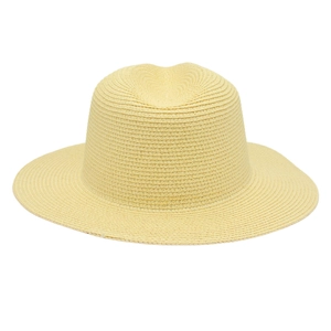 Detailed close-up of light yellow panama straw hat with fine spiral weave texture