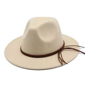 Detail of cream wool fedora hat with dark brown braided leather band and tassel fringe
