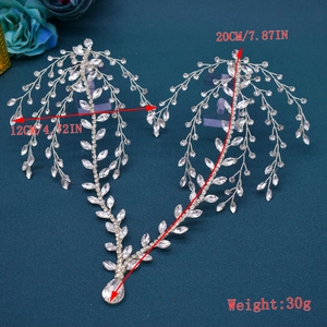 Detail showing bridal silver rhinestone headband dimensions 20cm by 12cm on blue fabric