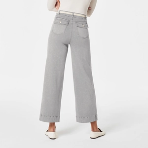 Rear view of grey high-waisted wide-leg denim jeans showcasing loose fit and straight cut