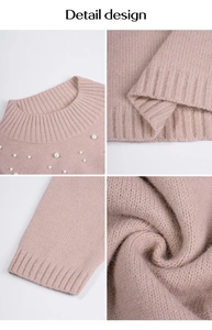 Détail d'un pull en maille rose poudré avec d'élégantes perles autour de l'encolure