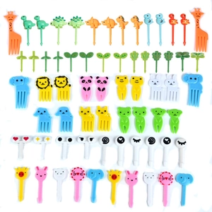 Macro shot of assorted colorful animal-shaped plastic fruit picks for kids bento boxes