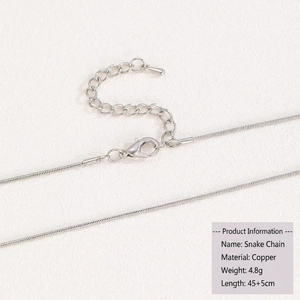 Detail of silver snake chain necklace made of copper with lobster clasp and extension